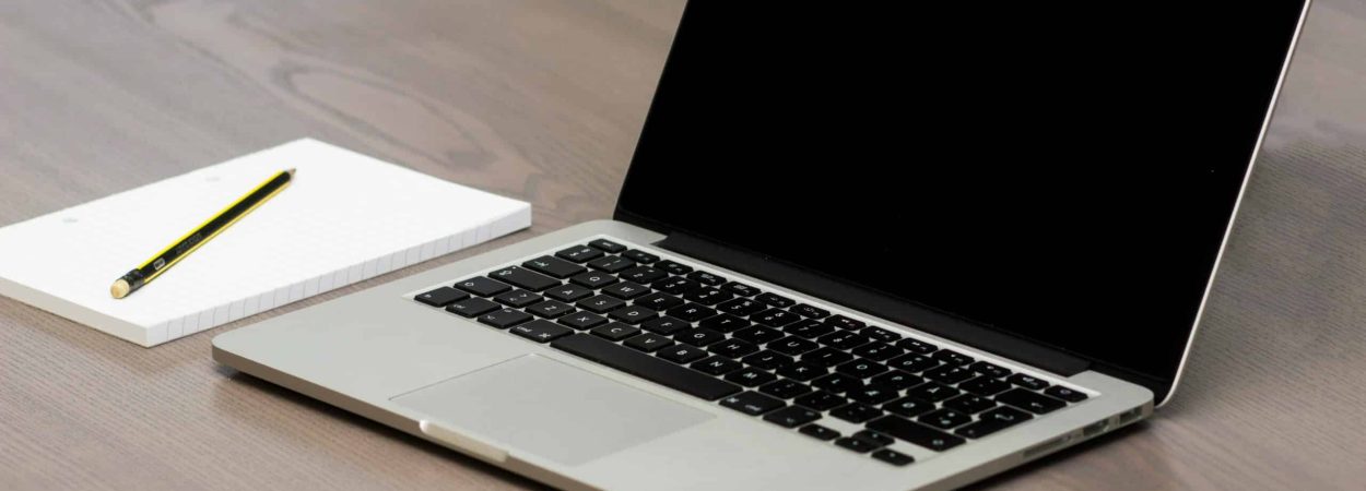 Free Silver Macbook Beside Iphone Stock Photo